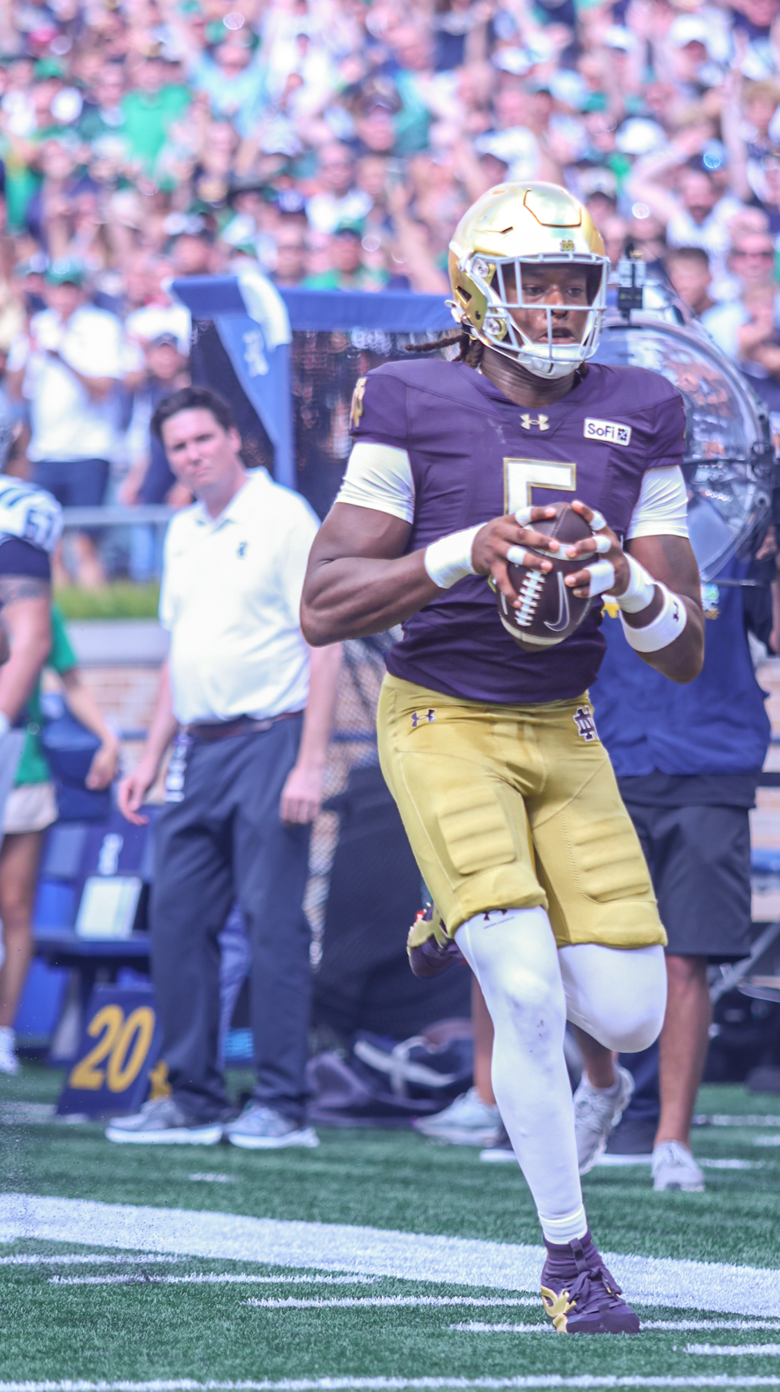 Football Player Putting On Helmet